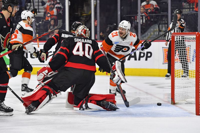 Mar 2, 2024; Philadelphia, Pennsylvania, USA; Philadelphia Flyers center Scott Laughton (21) reacts to goal scored by  left wing Joel Farabee (86) against Ottawa Senators goaltender Mads Sogaard (40) during the first period at Wells Fargo Center. Mandatory Credit: Eric Hartline-USA TODAY Sports