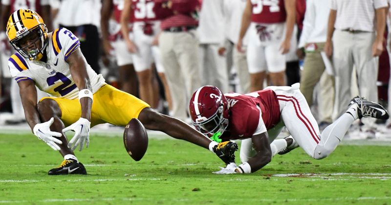 Nov 4, 2023; Tuscaloosa, Alabama, USA;  A pass intended for LSU Tigers wide receiver Kyren Lacy (2) falls incomplete with Alabama Crimson Tide defensive back Terrion Arnold (3) defending at Bryant-Denny Stadium. Mandatory Credit: Gary Cosby Jr.-USA TODAY Sports