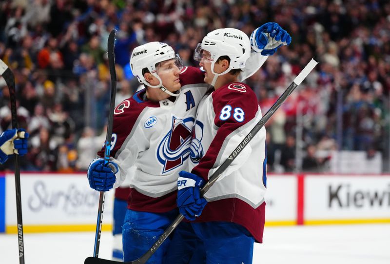 Dec 29, 2025; Denver, Colorado, USA; Colorado Avalanche center Martin Necas (88) (center) celebrates his goal scored with center Nathan MacKinnon (29) n the second period against the Los Angeles Kings at Ball Arena. Mandatory Credit: Ron Chenoy-Imagn Images