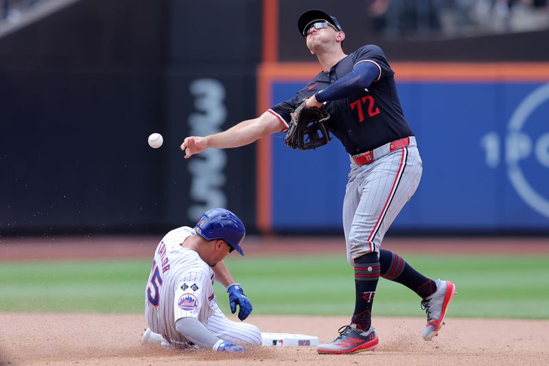 Jul 31, 2024; New York City, New York, USA; Minnesota Twins shortstop Brooks Lee (72) forces out New York Mets center fielder Tyrone Taylor (15) at second base and throws to first to complete a double play on a ball hit by New York Mets shortstop Francisco Lindor (not pictured) during the fifth inning at Citi Field. Mandatory Credit: Brad Penner-USA TODAY Sports