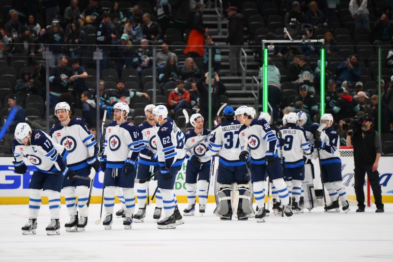 Mar 8, 2024; Seattle, Washington, USA; The Winnipeg Jets celebrate after defeating the Seattle Kraken at Climate Pledge Arena. Mandatory Credit: Steven Bisig-USA TODAY Sports