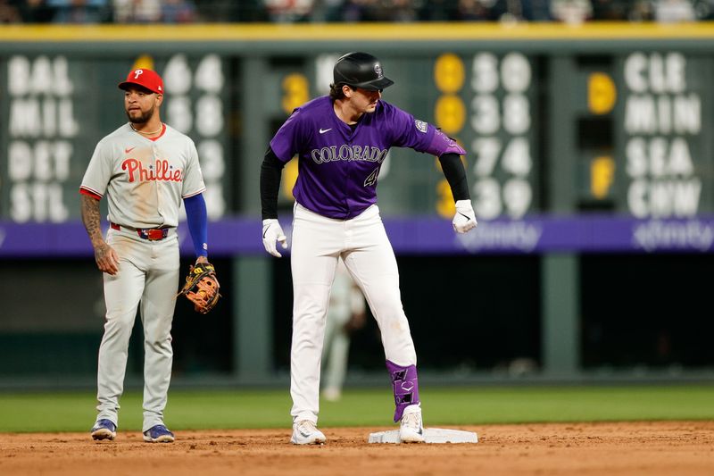May 19, 2025; Denver, Colorado, USA; Colorado Rockies first baseman Michael Toglia (4) reacts from second on a double in the sixth inning against the Philadelphia Phillies at Coors Field. Mandatory Credit: Isaiah J. Downing-Imagn Images