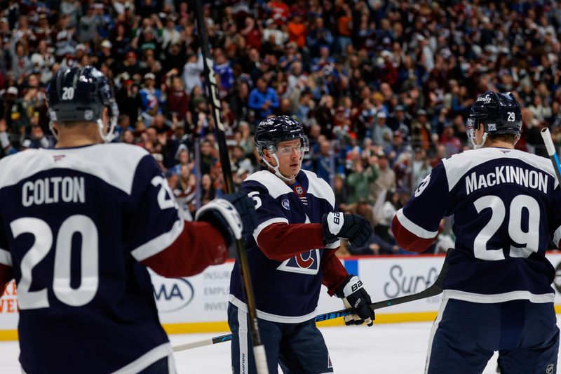 Dec 13, 2025; Denver, Colorado, USA; Colorado Avalanche left wing Victor Olofsson (95) celebrates his goal with center Nathan MacKinnon (29) and right wing Ross Colton (20) in the second period against the Nashville Predators at Ball Arena. Mandatory Credit: Isaiah J. Downing-Imagn Images