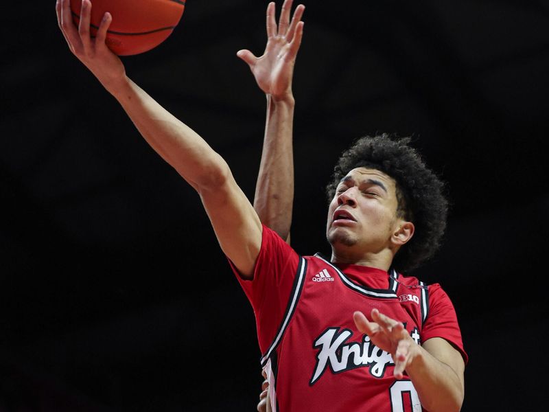 Feb 29, 2024; Piscataway, New Jersey, USA; Rutgers Scarlet Knights guard Derek Simpson (0) drives for a shot during the second half against the Michigan Wolverines at Jersey Mike's Arena. Mandatory Credit: Vincent Carchietta-USA TODAY Sports