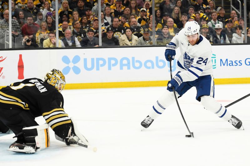 May 4, 2024; Boston, Massachusetts, USA; Toronto Maple Leafs center Connor Dewar (24) skates in alone on Boston Bruins goaltender Jeremy Swayman (1) during the second period in game seven of the first round of the 2024 Stanley Cup Playoffs at TD Garden. Mandatory Credit: Bob DeChiara-USA TODAY Sports