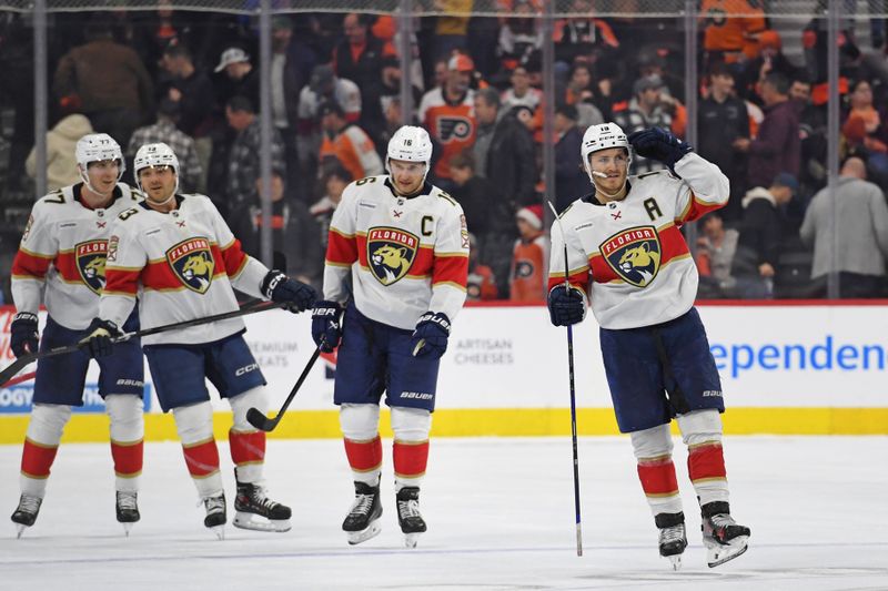 Dec 5, 2024; Philadelphia, Pennsylvania, USA; Florida Panthers left wing Matthew Tkachuk (19) celebrates his empty net goal with teammates against the Philadelphia Flyers during the third period at Wells Fargo Center. Mandatory Credit: Eric Hartline-Imagn Images