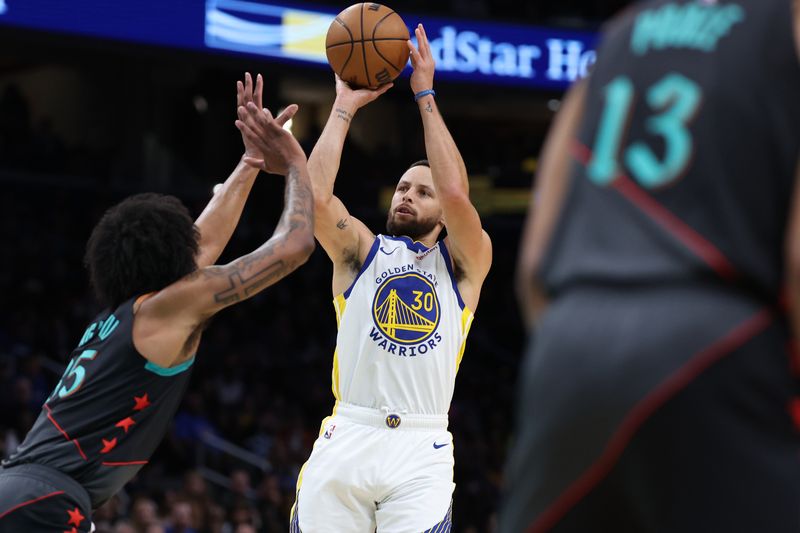 WASHINGTON, DC - FEBRUARY 27: Stephen Curry #30 of the Golden State Warriors shoots in front of Marvin Bagley III #35 of the Washington Wizards during the first half at Capital One Arena on February 27, 2024 in Washington, DC. NOTE TO USER: User expressly acknowledges and agrees that, by downloading and or using this photograph, User is consenting to the terms and conditions of the Getty Images License Agreement. (Photo by Patrick Smith/Getty Images)