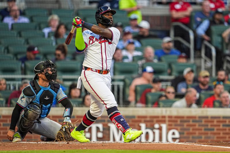 Apr 23, 2024; Cumberland, Georgia, USA; Atlanta Braves outfielder Michael Harris II (23) hits a double to drive in a run against the Miami Marlins during the second inning at Truist Park. Mandatory Credit: Dale Zanine-USA TODAY Sports