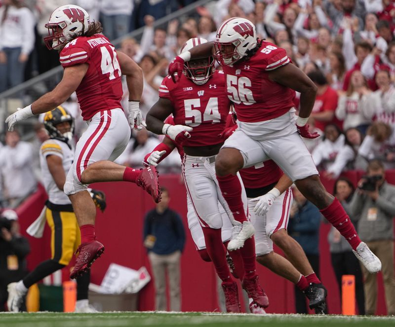 Oct 14, 2023; Madison, Wisconsin, USA; Wisconsin Badgers linebacker Jeff Pietrowski Jr. (44) reacts after stopping Iowa Hawkeyes wide receiver Nico Ragaini (89) on fourth down during the first quarter at Camp Randall Stadium. Mandatory Credit: Mark Hoffman-USA TODAY Sports