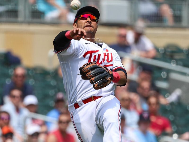 May 24, 2023; Minneapolis, Minnesota, USA; Minnesota Twins third baseman Donovan Solano (39) attempts to throw out San Francisco Giants second baseman Brett Wisely (not pictured) at first base during the sixth inning at Target Field. Mandatory Credit: Matt Krohn-USA TODAY Sports