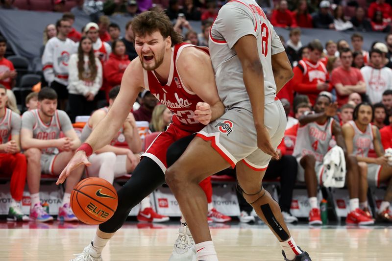 Mar 4, 2025; Columbus, Ohio, USA;  Nebraska Cornhuskers forward Andrew Morgan (23) drives to the basket as Ohio State Buckeyes forward Sean Stewart (13) defends during the first half at Value City Arena. Mandatory Credit: Joseph Maiorana-Imagn Images