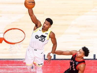 TORONTO, CANADA - DECEMBER 23:  Ochai Agbaji #30 of the Utah Jazz drives to the basket during the game against the Toronto Raptors on December 23, 2023 at the Scotiabank Arena in Toronto, Ontario, Canada.  NOTE TO USER: User expressly acknowledges and agrees that, by downloading and or using this Photograph, user is consenting to the terms and conditions of the Getty Images License Agreement.  Mandatory Copyright Notice: Copyright 2023 NBAE (Photo by Vaughn Ridley/NBAE via Getty Images)