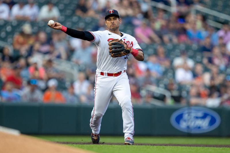 May 23, 2023; Minneapolis, Minnesota, USA; Minnesota Twins third baseman Donovan Solano (39) throws to first base for an out in the fourth inning against the San Francisco Giants at Target Field. Mandatory Credit: Jesse Johnson-USA TODAY Sports