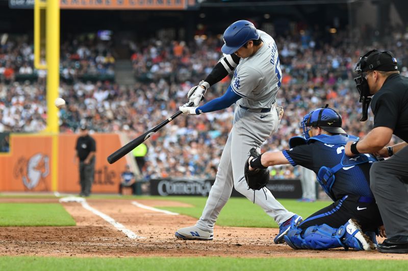 Jul 12, 2024; Detroit, Michigan, USA;  Los Angeles Dodgers designated hitter Shohei Ohtani (17) flies out to left field in the fifth inning at Comerica Park. Mandatory Credit: Lon Horwedel-USA TODAY Sports