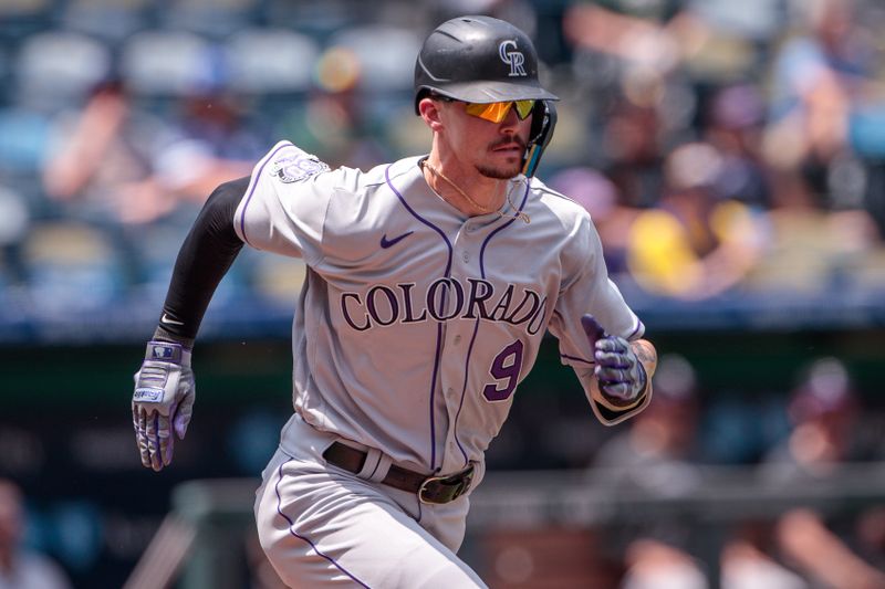 Jun 4, 2023; Kansas City, Missouri, USA; Colorado Rockies center fielder Brenton Doyle (9) heads to first base during the fifth inning against the Kansas City Royals at Kauffman Stadium. Mandatory Credit: William Purnell-USA TODAY Sports