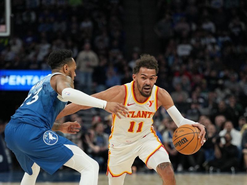 MINNEAPOLIS, MN -  APRIL 12: Trae Young #11 of the Atlanta Hawks handles the ball during the game against the Minnesota Timberwolves on April 12, 2024 at Target Center in Minneapolis, Minnesota. NOTE TO USER: User expressly acknowledges and agrees that, by downloading and or using this Photograph, user is consenting to the terms and conditions of the Getty Images License Agreement. Mandatory Copyright Notice: Copyright 2024 NBAE (Photo by Jordan Johnson/NBAE via Getty Images)