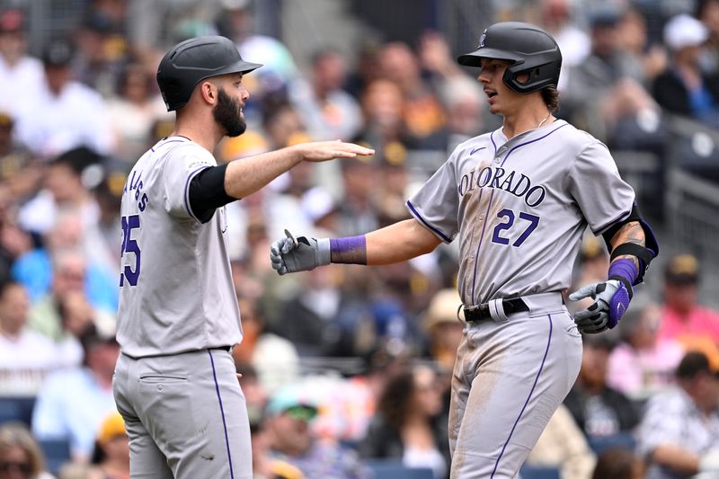 May 15, 2024; San Diego, California, USA; Colorado Rockies left fielder Jordan Beck (27) is congratulated by catcher Jacob Stallings (25) after hitting a two-run home run against the San Diego Padres during the sixth inning at Petco Park. Mandatory Credit: Orlando Ramirez-USA TODAY Sports