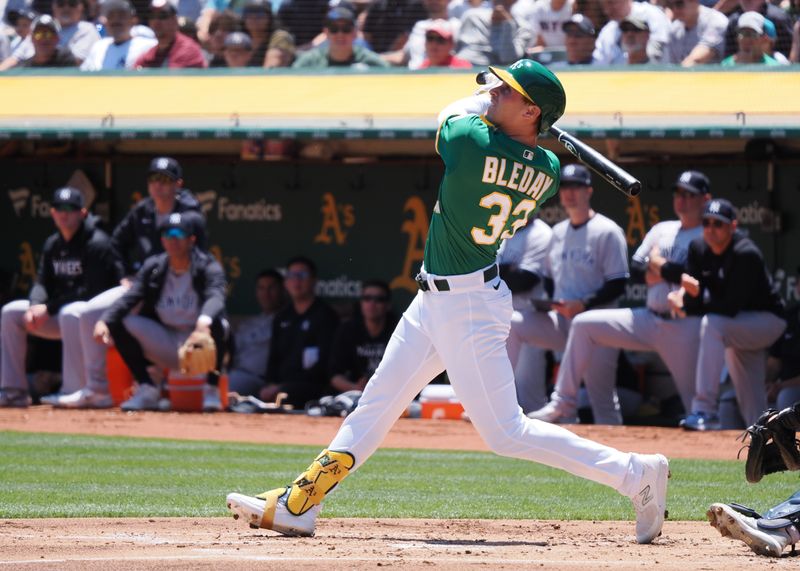 Jun 29, 2023; Oakland, California, USA; Oakland Athletics left fielder JJ Bleday (33) hits a sacrifice fly against the New York Yankees during the first inning at Oakland-Alameda County Coliseum. Mandatory Credit: Kelley L Cox-USA TODAY Sports