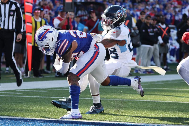 Buffalo Bills running back Ray Davis (22) runs for a touchdown past Tennessee Titans safety Quandre Diggs (28) during the second half of an NFL football game Sunday, Oct. 20, 2024, in Orchard Park, N.Y. (AP Photo/Jeffrey T. Barnes)