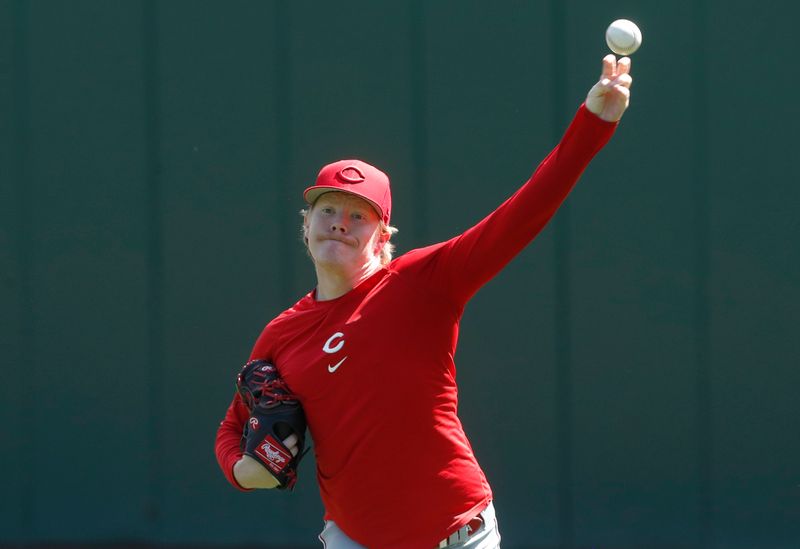 Aug 13, 2023; Pittsburgh, Pennsylvania, USA; Cincinnati Reds pitcher Andrew Abbott (41) throws in the outfield before the game against the Pittsburgh Pirates at PNC Park. Mandatory Credit: Charles LeClaire-USA TODAY Sports