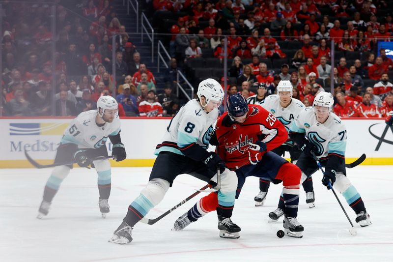 Oct 21, 2025; Washington, District of Columbia, USA; Washington Capitals center Nic Dowd (26) and Seattle Kraken defenseman Cale Fleury (8) battle for the puck during the third period at Capital One Arena. Mandatory Credit: Geoff Burke-Imagn Images