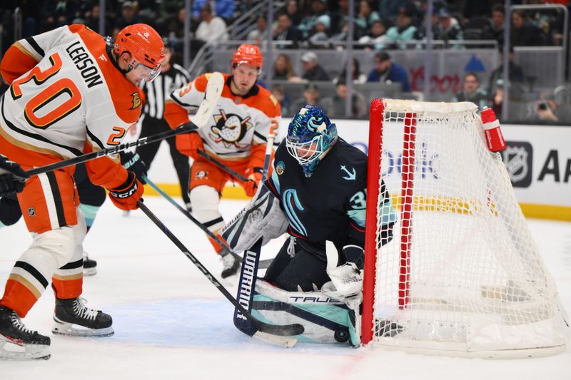 Nov 27, 2024; Seattle, Washington, USA; Seattle Kraken goaltender Joey Daccord (35) blocks a goal shot by Anaheim Ducks right wing Brett Leason (20) during the second period at Climate Pledge Arena. Mandatory Credit: Steven Bisig-Imagn Images