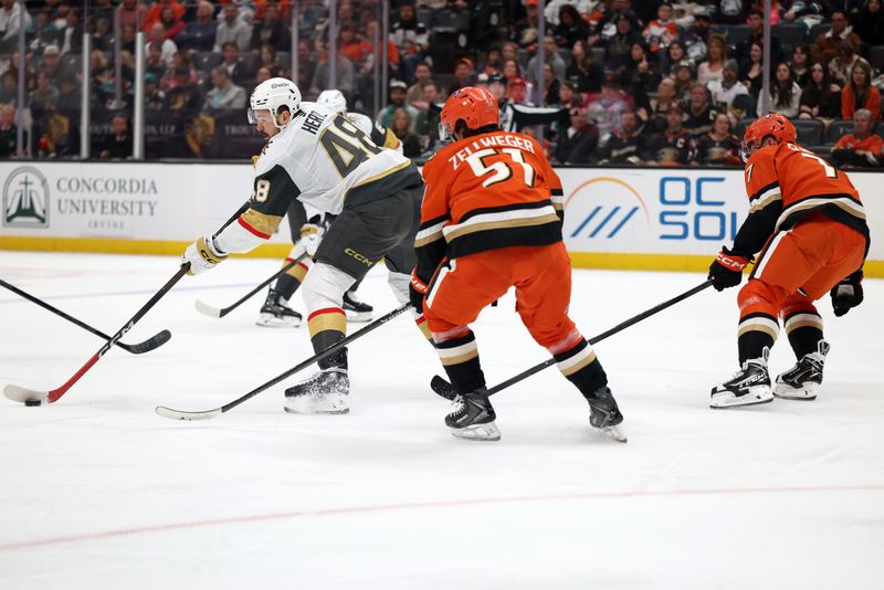 Feb 1, 2026; Anaheim, California, USA;  Vegas Golden Knights center Tomas Hertl (48) controls the puck against Anaheim Ducks defenseman Olen Zellweger (51) during the first period at Honda Center. Mandatory Credit: Kiyoshi Mio-Imagn Images