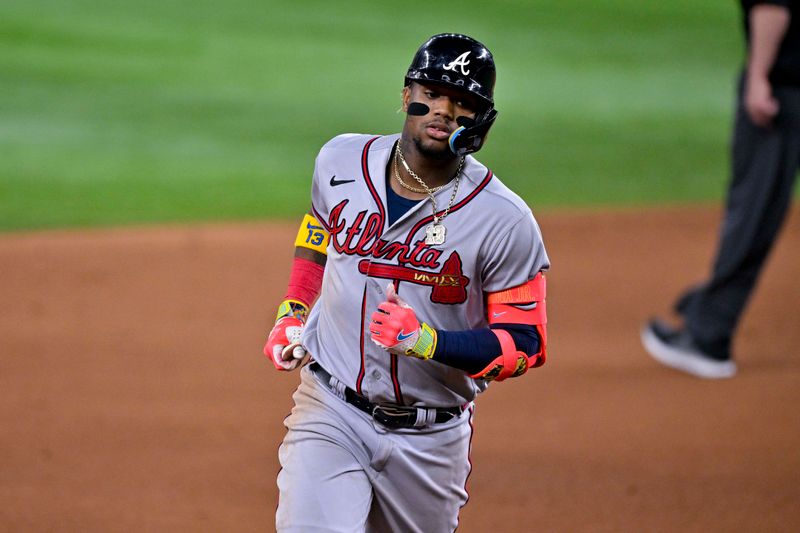 May 16, 2023; Arlington, Texas, USA; Atlanta Braves right fielder Ronald Acuna Jr. (13) rounds the bases after hitting a home run against the Texas Rangers during the eighth inning at Globe Life Field. Mandatory Credit: Jerome Miron-USA TODAY Sports