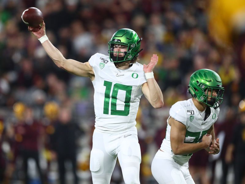 Nov 23, 2019; Tempe, AZ, USA; Oregon Ducks quarterback Justin Herbert (10) against the Arizona State Sun Devils in the first half at Sun Devil Stadium. Mandatory Credit: Mark J. Rebilas-USA TODAY Sports