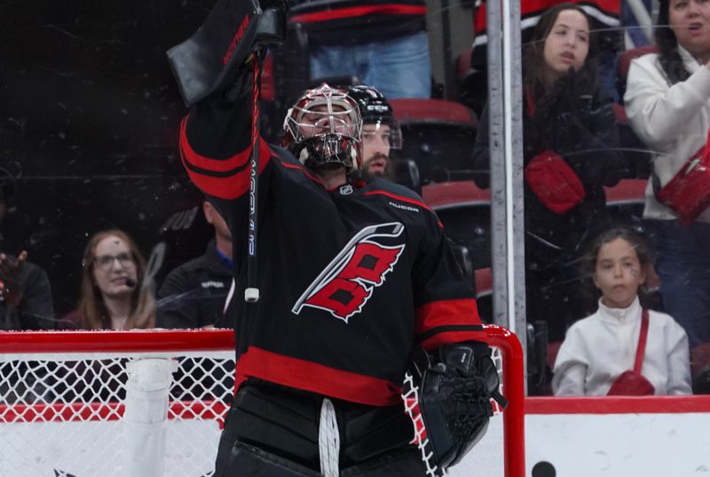 Nov 16, 2024; Raleigh, North Carolina, USA;  Carolina Hurricanes goaltender Spencer Martin (41) celebrates their victory against the Ottawa Senators at Lenovo Center. Mandatory Credit: James Guillory-Imagn Images