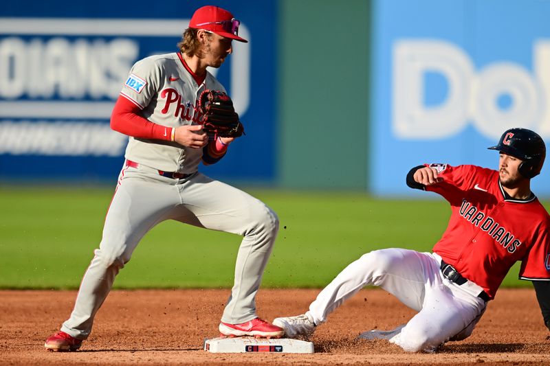 May 10, 2025; Cleveland, Ohio, USA; Philadelphia Phillies second baseman Bryson Stott (5) forces out Cleveland Guardians second baseman Will Wilson (7) during the third inning at Progressive Field. Mandatory Credit: Ken Blaze-Imagn Images