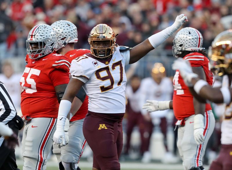 Nov 18, 2023; Columbus, Ohio, USA;  Minnesota Golden Gophers defensive lineman Jalen Logan-Redding (97) celebrates a third down stop during the first quarter against the Ohio State Buckeyes at Ohio Stadium. Mandatory Credit: Joseph Maiorana-USA TODAY Sports