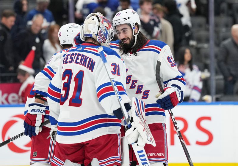 Dec 19, 2023; Toronto, Ontario, CAN; New York Rangers center Mika Zibanejad (93) celebrates the win with s goaltender Igor Shesterkin (31) against the Toronto Maple Leafs at the end of the third period at Scotiabank Arena. Mandatory Credit: Nick Turchiaro-USA TODAY Sports