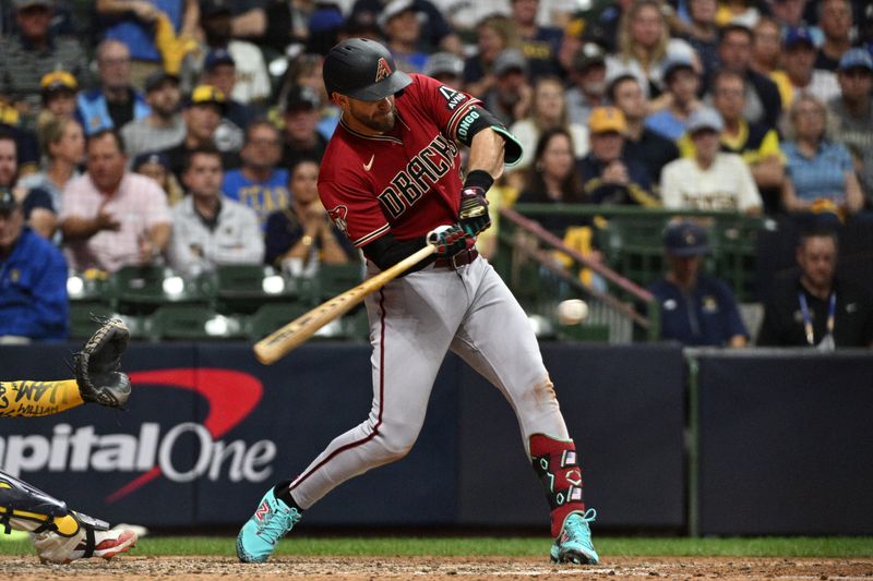 Oct 3, 2023; Milwaukee, Wisconsin, USA; Arizona Diamondbacks third baseman Evan Longoria (3) hits a single in the sixth inning during game one of the Wildcard series for the 2023 MLB playoffs at American Family Field. Mandatory Credit: Michael McLoone-USA TODAY Sports