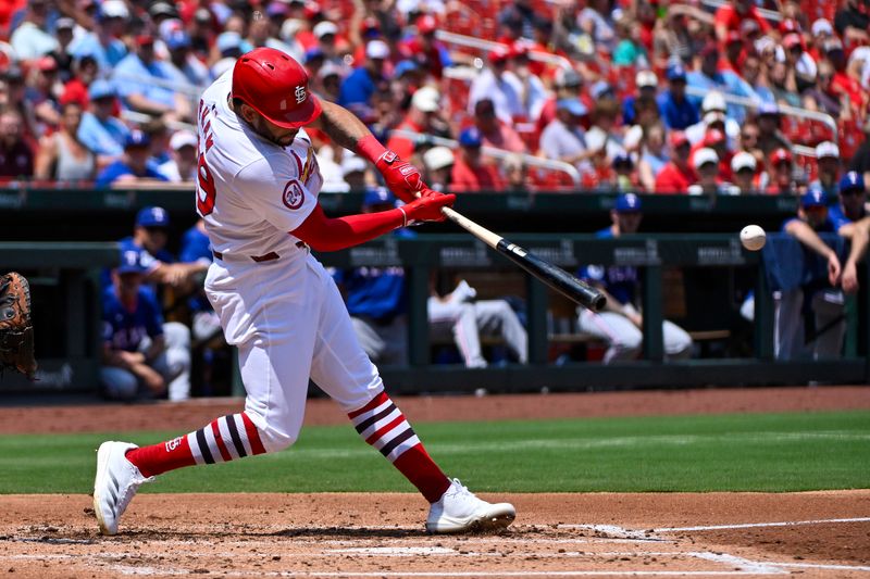 Jul 31, 2024; St. Louis, Missouri, USA;  St. Louis Cardinals right fielder Tommy Pham (29) hits a single against the Texas Rangers during the second inning at Busch Stadium. Mandatory Credit: Jeff Curry-USA TODAY Sports