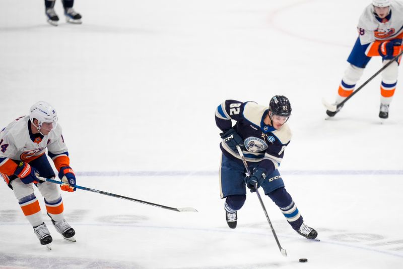 Oct 30, 2024; Columbus, Ohio, USA; KColumbus Blue Jackets left wing Mikael Pyyhtia (82) skates with the puck against the New York Islanders in the second period at Nationwide Arena. Mandatory Credit: Samantha Madar-Imagn Images