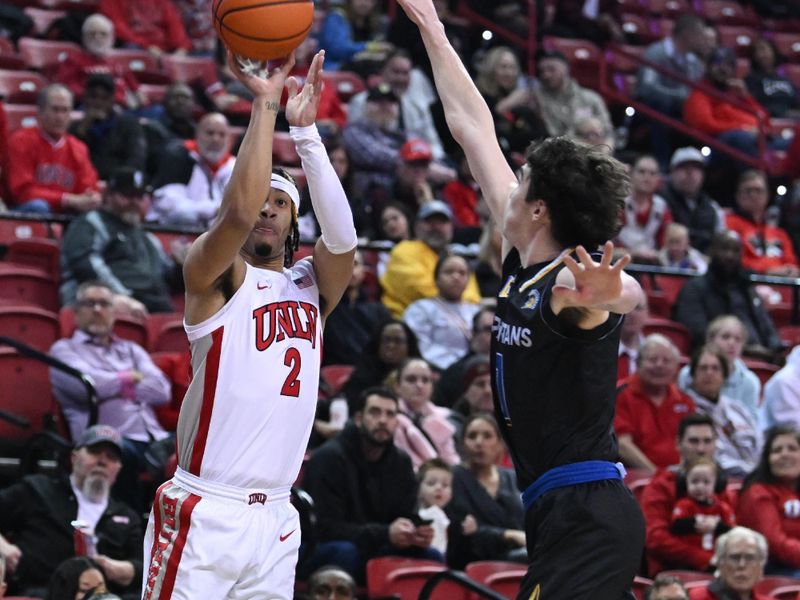 Feb 14, 2023; Las Vegas, Nevada, USA; UNLV Runnin' Rebels guard Justin Webster (2) takes a shot against San Jose State Spartans guard Garrett Anderson (1) in the first half at Thomas & Mack Center. Mandatory Credit: Candice Ward-USA TODAY Sports