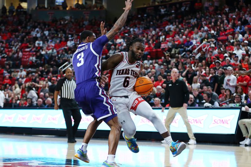 Feb 20, 2024; Lubbock, Texas, USA;  Texas Tech Red Raiders guard Joe Toussaint (6) drives to the lane against TCU Horned Frogs guard Avery Anderson III (3) in the first half at United Supermarkets Arena. Mandatory Credit: Michael C. Johnson-USA TODAY Sports