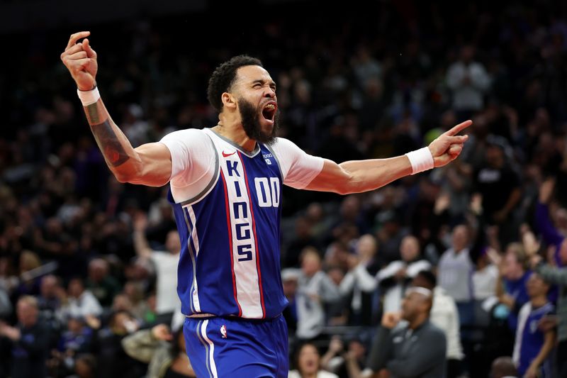 SACRAMENTO, CALIFORNIA - JANUARY 22: JaVale McGee #00 of the Sacramento Kings reacts after he dunked the ball against the Atlanta Hawks in the second half at Golden 1 Center on January 22, 2024 in Sacramento, California. NOTE TO USER: User expressly acknowledges and agrees that, by downloading and or using this photograph, User is consenting to the terms and conditions of the Getty Images License Agreement.  (Photo by Ezra Shaw/Getty Images)