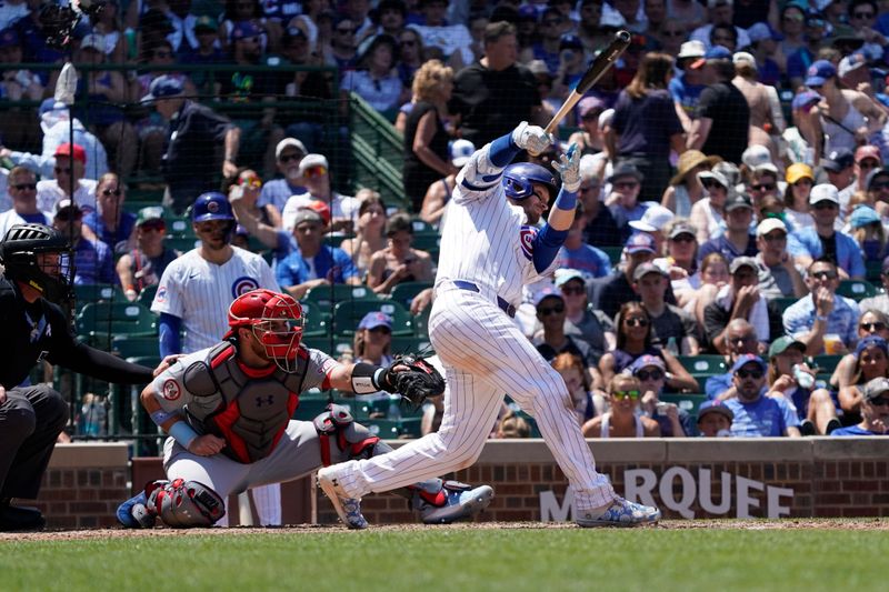 Jun 16, 2024; Chicago, Illinois, USA; Chicago Cubs outfielder Ian Happ (8) hits a double against the St. Louis Cardinals during the seventh inning at Wrigley Field. Mandatory Credit: David Banks-USA TODAY Sports