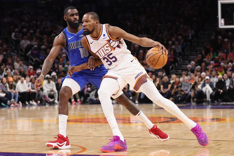 PHOENIX, ARIZONA - DECEMBER 25: Kevin Durant #35 of the Phoenix Suns handles the ball against Tim Hardaway Jr. #10 of the Dallas Mavericks during the second half of the NBA game at Footprint Center on December 25, 2023 in Phoenix, Arizona. The Mavericks defeated the Suns 128-114. NOTE TO USER: User expressly acknowledges and agrees that, by downloading and or using this photograph, User is consenting to the terms and conditions of the Getty Images License Agreement.  (Photo by Christian Petersen/Getty Images)