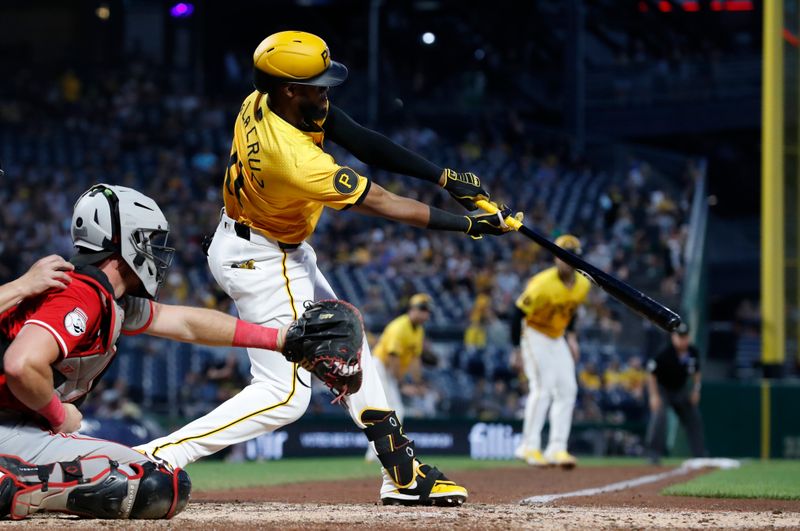 Aug 23, 2024; Pittsburgh, Pennsylvania, USA;  Pittsburgh Pirates right fielder Bryan De La Cruz (41) hits an RBI double against the Cincinnati Reds during the fifth inning  at PNC Park. Mandatory Credit: Charles LeClaire-USA TODAY Sports