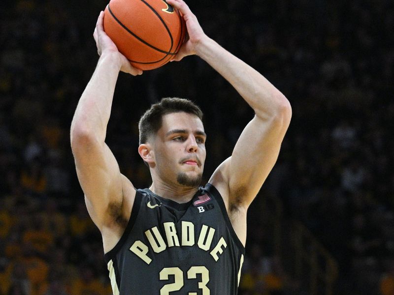 Jan 20, 2024; Iowa City, Iowa, USA; Purdue Boilermakers forward Camden Heide (23) controls the ball against the Iowa Hawkeyes during the second half at Carver-Hawkeye Arena. Mandatory Credit: Jeffrey Becker-USA TODAY Sports