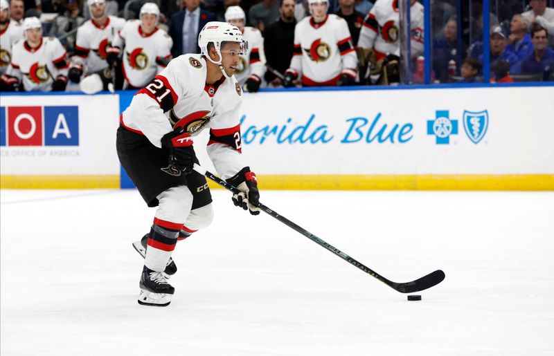 Nov 1, 2022; Tampa, Florida, USA; Ottawa Senators right wing Mathieu Joseph (21) skates with the puck and scores a goal against the Tampa Bay Lightning during the second period at Amalie Arena. Mandatory Credit: Kim Klement-USA TODAY Sports