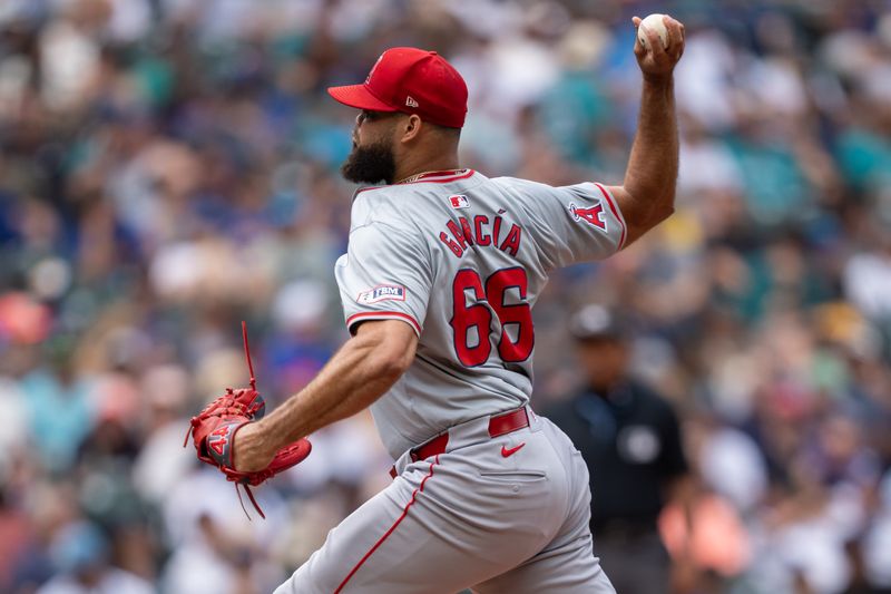 Jul 24, 2024; Seattle, Washington, USA;  Los Angeles Angels reliever Luis Garcia (66) delivers a pitch during the eighth inning against the Seattle Mariners at T-Mobile Park. Mandatory Credit: Stephen Brashear-USA TODAY Sports