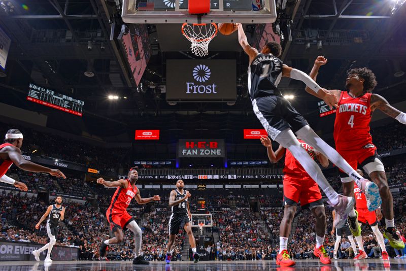 SAN ANTONIO, TX - MARCH 12: Victor Wembanyama #1 of the San Antonio Spurs drives to the basket during the game against the Houston Rockets on March 12, 2024 at the Frost Bank Center in San Antonio, Texas. NOTE TO USER: User expressly acknowledges and agrees that, by downloading and or using this photograph, user is consenting to the terms and conditions of the Getty Images License Agreement. Mandatory Copyright Notice: Copyright 2024 NBAE (Photos by Jesse D. Garrabrant/NBAE via Getty Images)