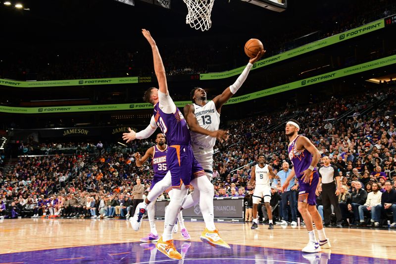 PHOENIX, AZ - JANUARY  7: Jaren Jackson Jr. #13 of the Memphis Grizzlies shoots the ball during the game against the Phoenix Suns on January 7, 2024 at Footprint Center in Phoenix, Arizona. NOTE TO USER: User expressly acknowledges and agrees that, by downloading and or using this photograph, user is consenting to the terms and conditions of the Getty Images License Agreement. Mandatory Copyright Notice: Copyright 2024 NBAE (Photo by Kate Frese/NBAE via Getty Images)