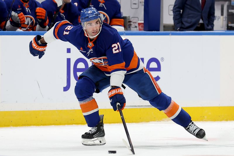 Jan 24, 2025; Elmont, New York, USA; New York Islanders center Kyle Palmieri (21) skates with the puck against the Philadelphia Flyers during the second period at UBS Arena. Mandatory Credit: Brad Penner-Imagn Images