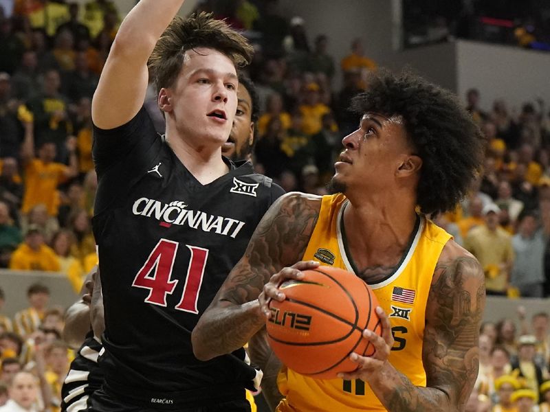 Jan 13, 2024; Waco, Texas, USA; Baylor Bears forward Jalen Bridges (11) looks to shoot on Cincinnati Bearcats guard Simas Lukosius (41) during the second half at Paul and Alejandra Foster Pavilion. Mandatory Credit: Raymond Carlin III-USA TODAY Sports