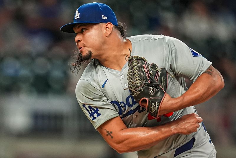Sep 15, 2024; Cumberland, Georgia, USA; Los Angeles Dodgers relief pitcher Brusdar Graterol (48) pitches against the Atlanta Braves during the ninth inning at Truist Park. Mandatory Credit: Dale Zanine-Imagn Images